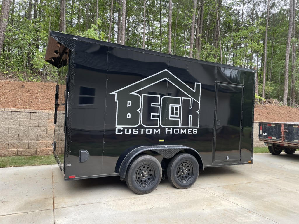 Beech Custom Homes enclosed trailer with installed business graphics